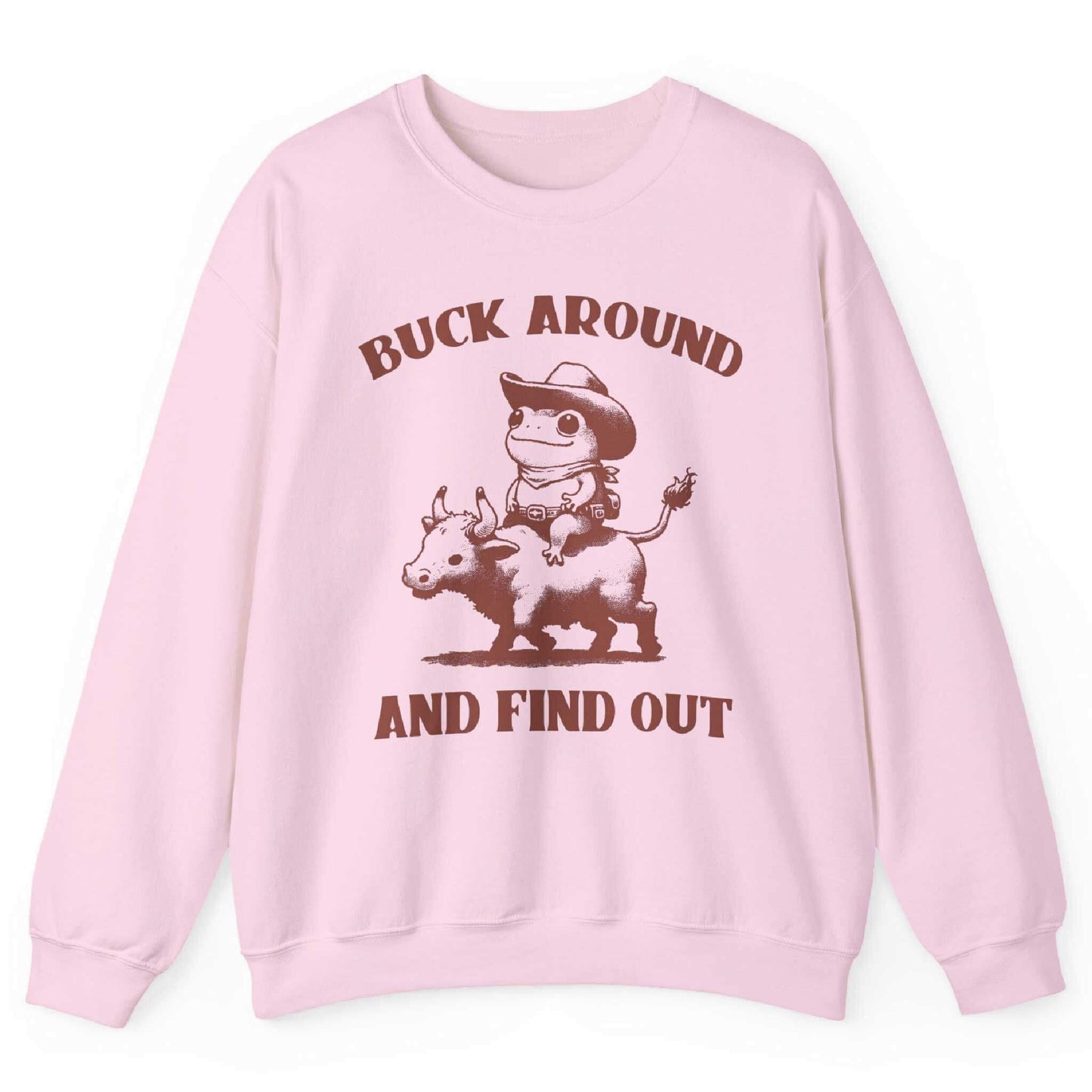 Light pink sweatshirt with cowboy frog riding bull and “Buck Around and Find Out” text – front view, by Shirtcasm