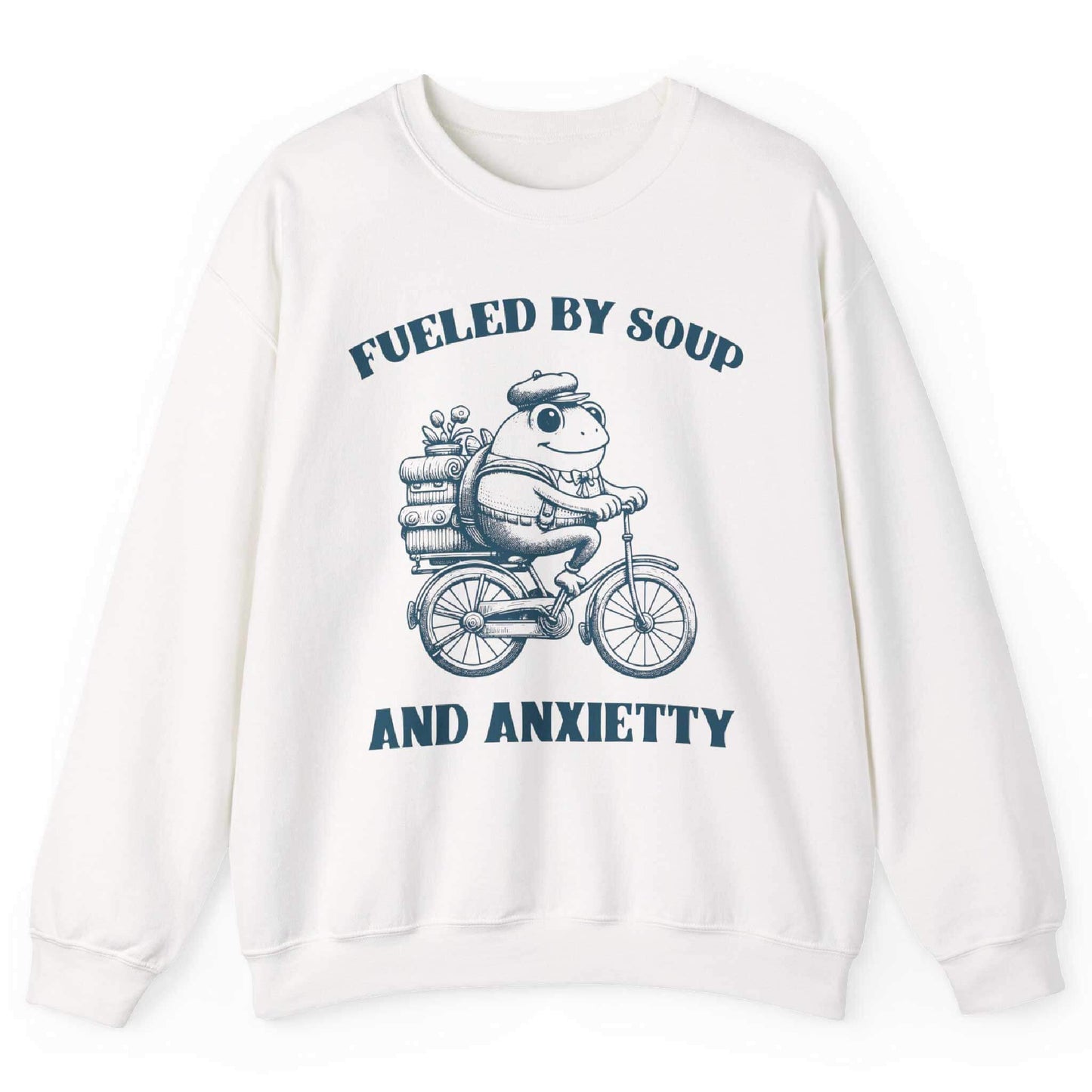 White sweatshirt with frog riding bicycle carrying soup cans and “Fueled by Soup and Anxiety” text – front view, by Shirtcasm