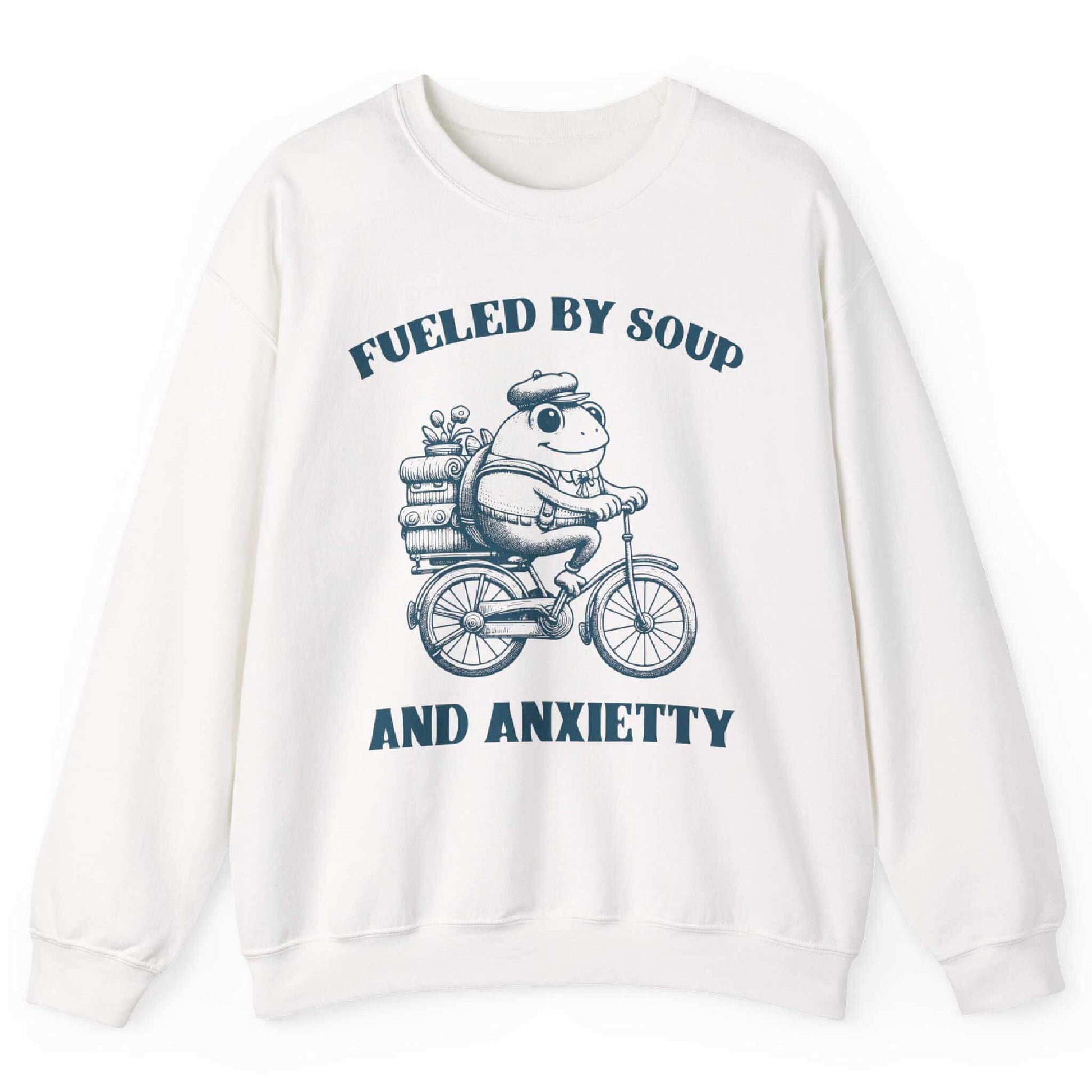 White sweatshirt with frog riding bicycle carrying soup cans and “Fueled by Soup and Anxiety” text – front view, by Shirtcasm