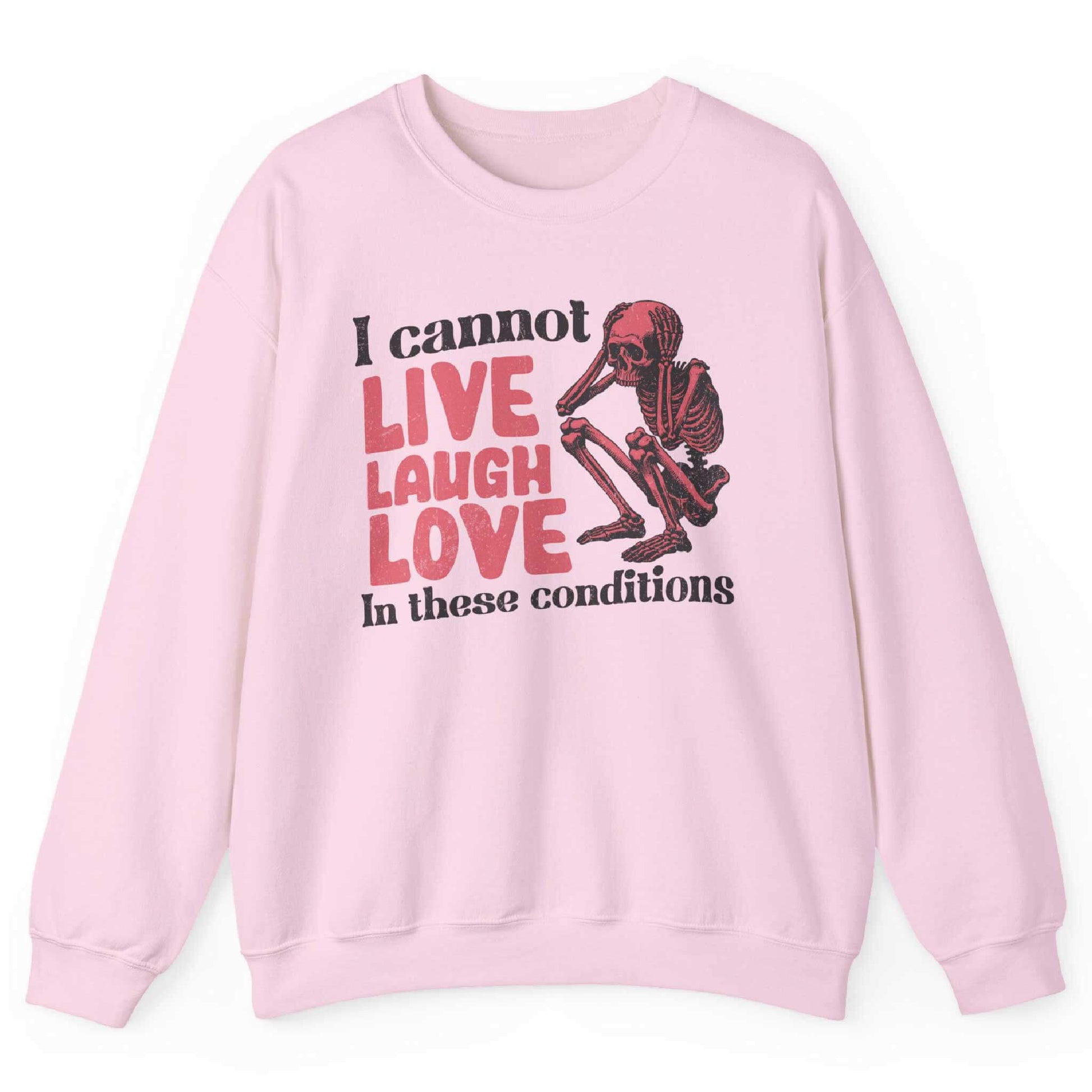 Light pink sweatshirt with distressed skeleton graphic and “I Cannot Live Laugh Love In These Conditions” text – front view, by Shirtcasm