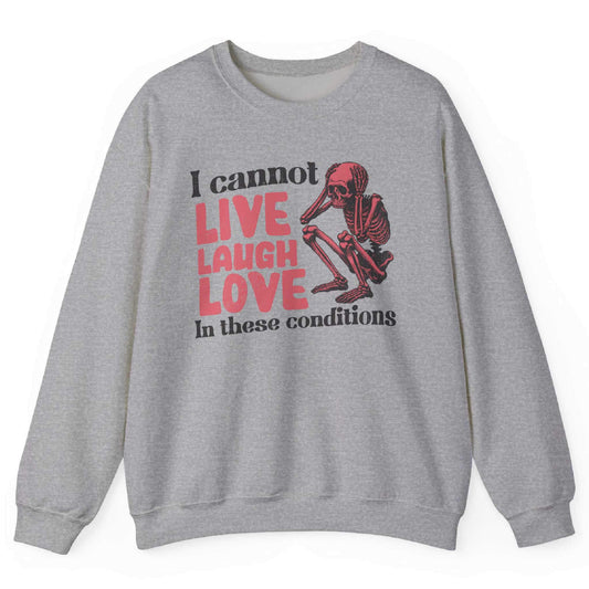 Sport Grey sweatshirt with distressed skeleton graphic and “I Cannot Live Laugh Love In These Conditions” text – front view, by Shirtcasm