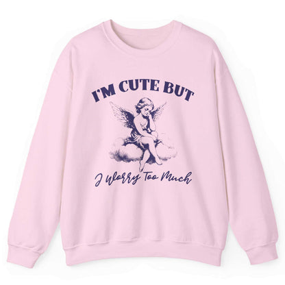 Light pink sweatshirt with angel on a cloud and “I’m Cute But I Worry Too Much” text – front view, by Shirtcasm